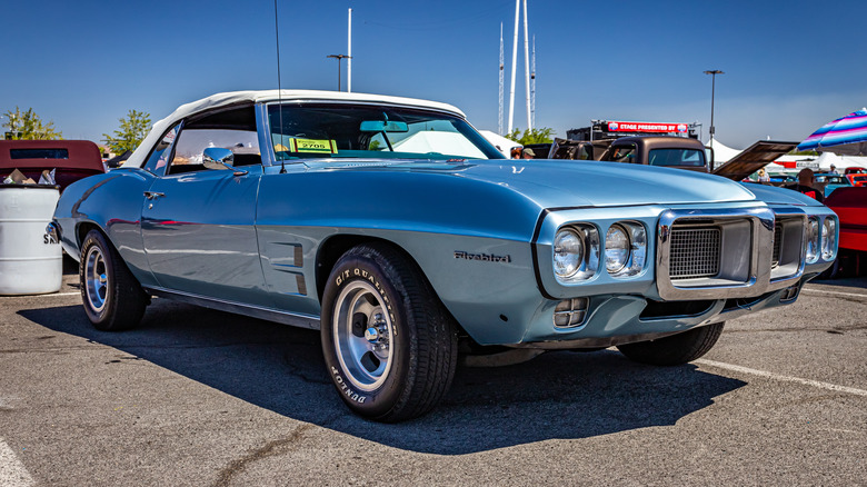 A blue 1969 Pontiac Firebird convertible