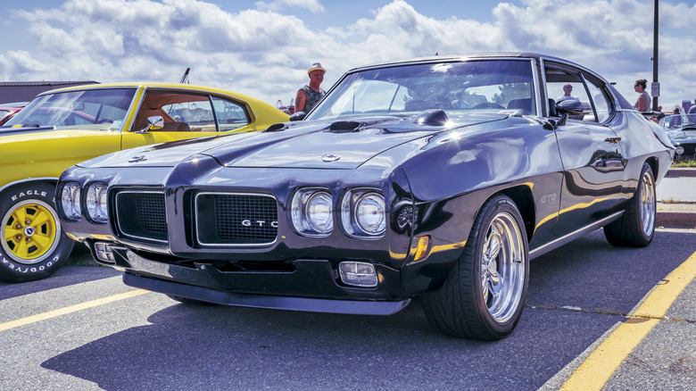 A 1970 Pontiac GTO in a parking space