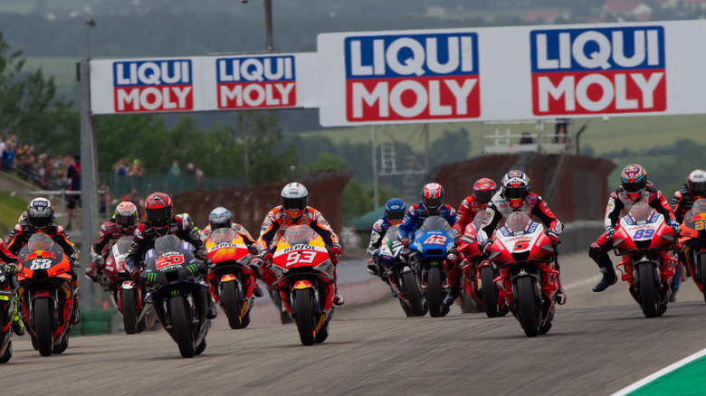 Motorcycles racing in front of Liqui Moly banners