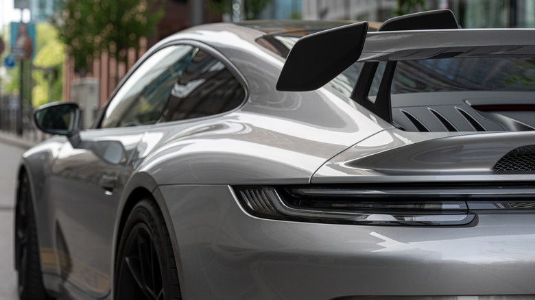 Porsche 992 GT3 parked, rear left side visible