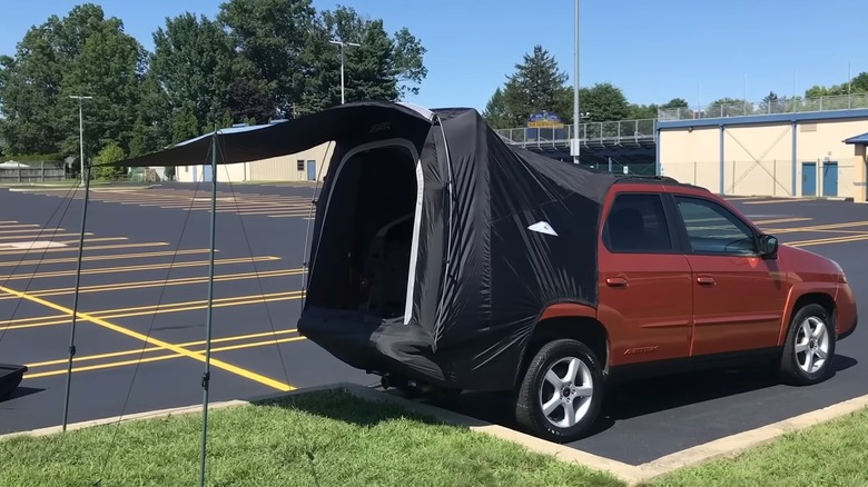 Pontiac Aztek tent set up parking lot