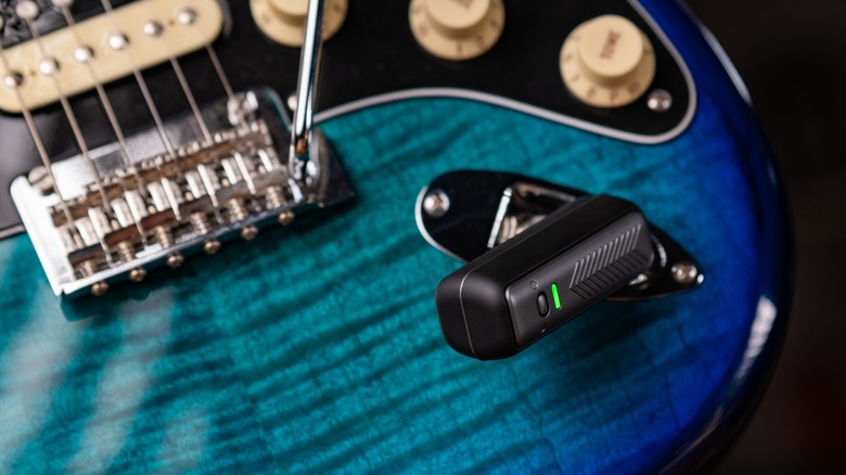 Spark Neo wireless transmitter plugged into a blue Fender Stratocaster.