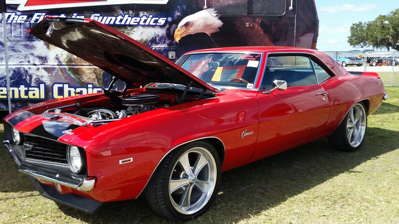 Red 1969 Chevrolet Camaro pro-touring parked