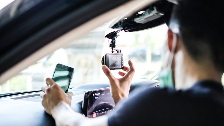 Person installing dashcam