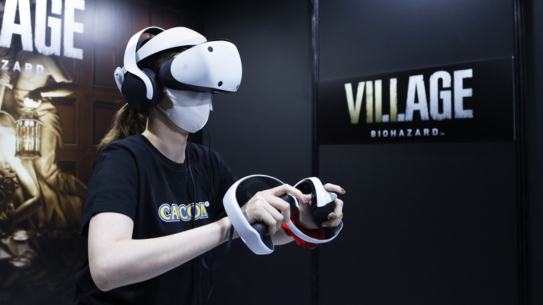 young woman using a PSVR 2