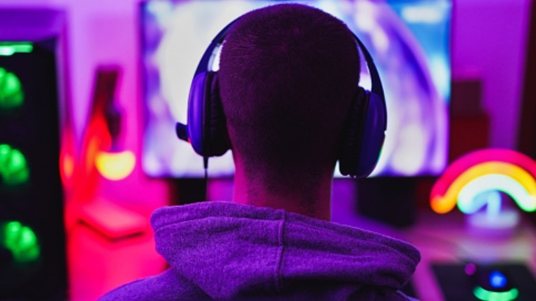 A gamer playing with a headset