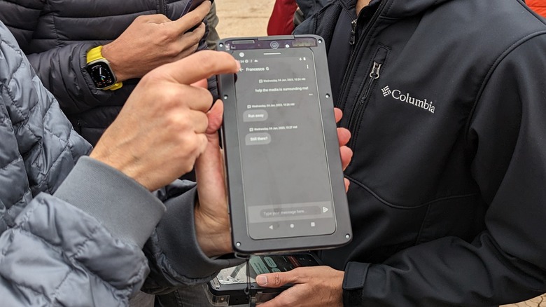 Man holds a Qualcomm phone