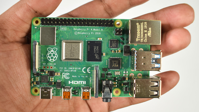 hand holding raspberry pi board