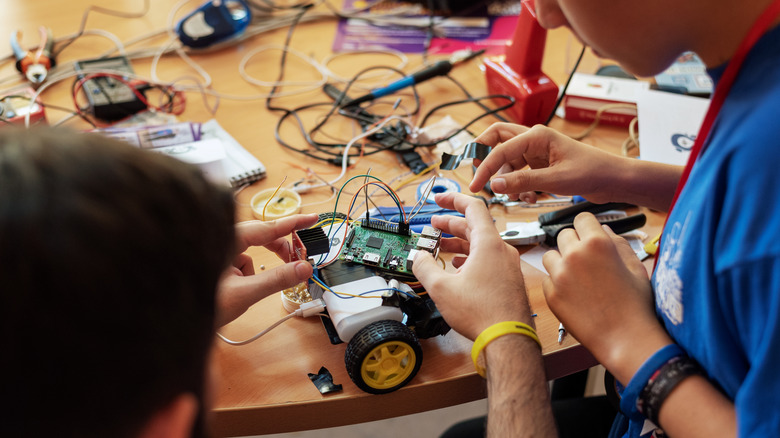 Boy and father building RC car