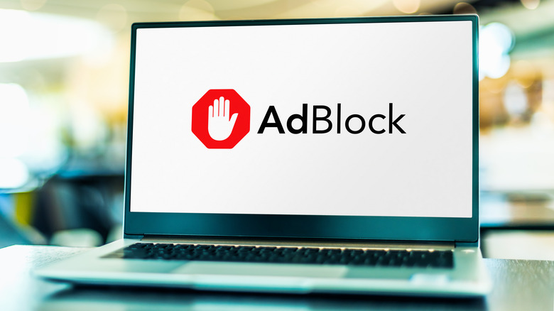 AdBlock logo on a silver laptop