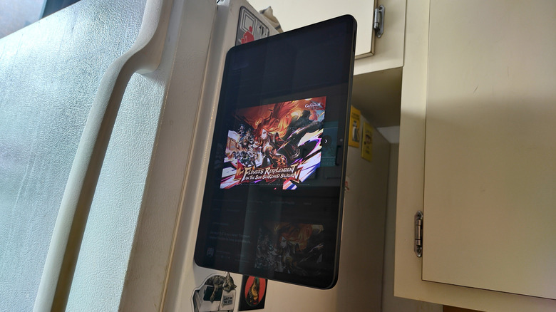 Nova Gaming Tablet magnetized to the side of a refrigerator