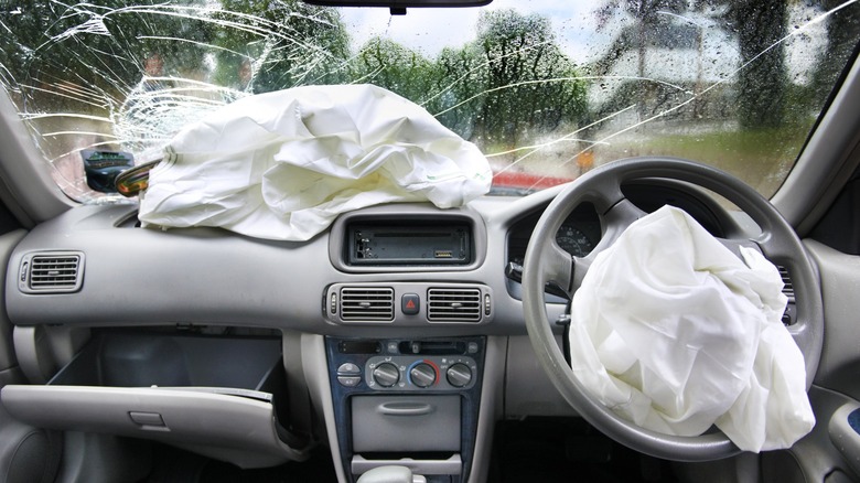 Deployed airbag in entire dashboard with cracked window