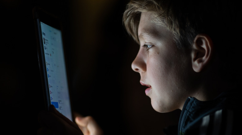 A person glued to a screen