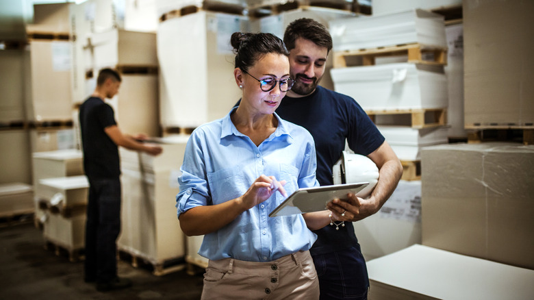 warehouse workers with tablet