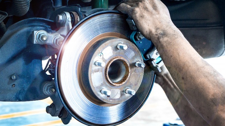 mechanic working on brakes