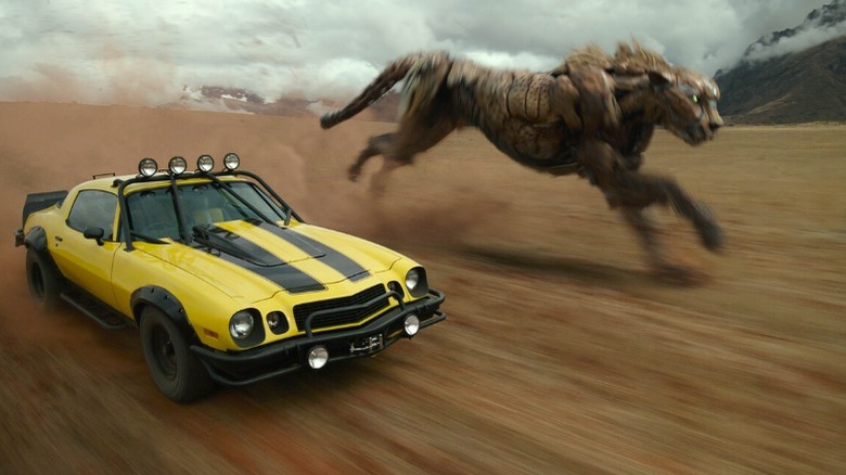 Bumblebee driving alongside a beast