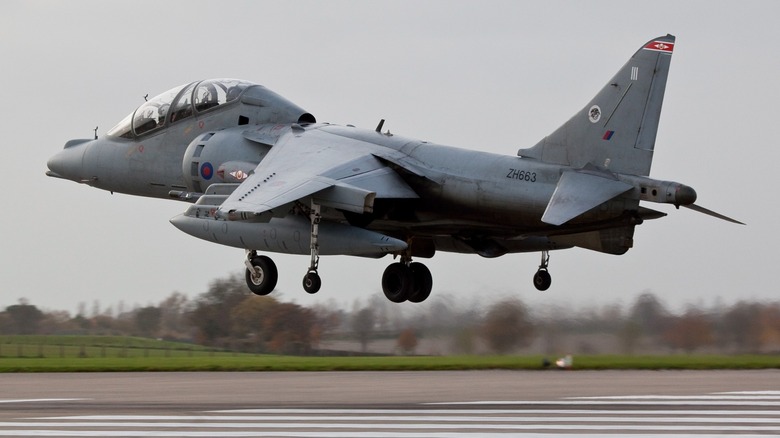 RAF Harrier jet taking off from a runway in the U.K.