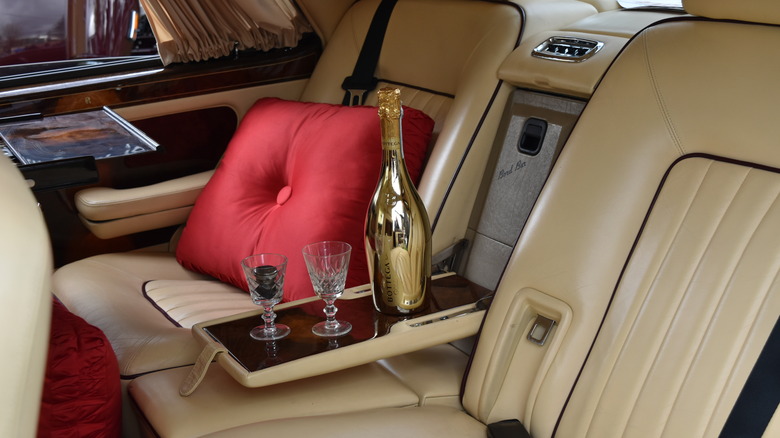 Classic Rolls-Royce with champagne and glasses