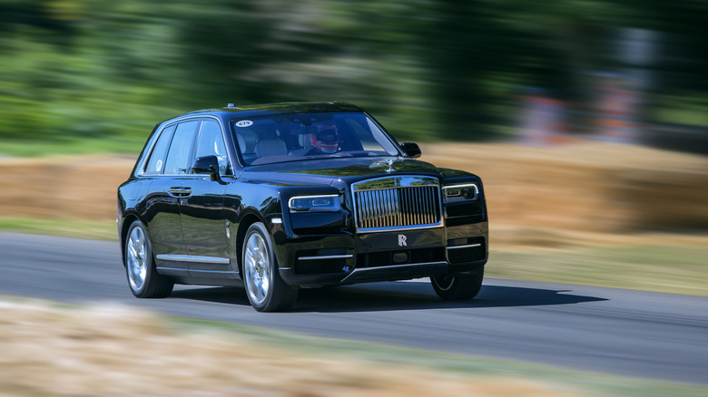 Rolls-Royce Cullinan driving fast at Goodwood