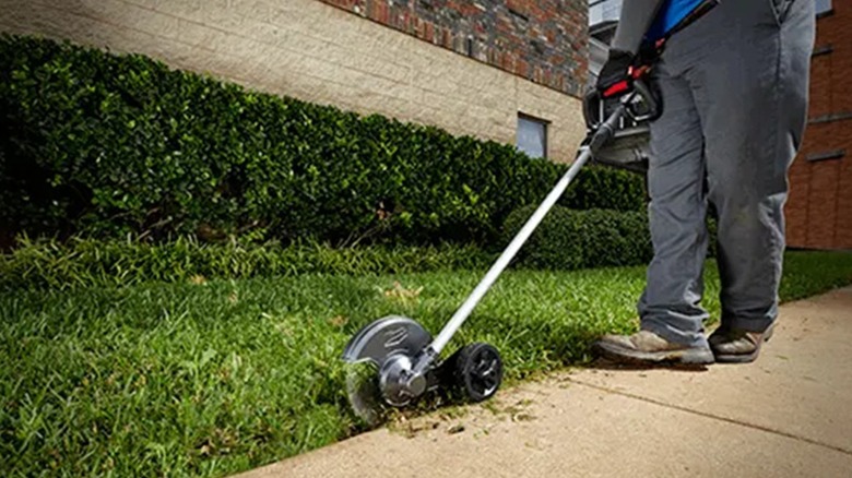 Milwaukee Tool's Quik-Lok Edger cutting grass