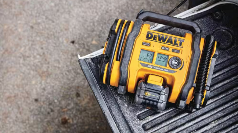 DeWalt inflator sitting on a truck tailgate