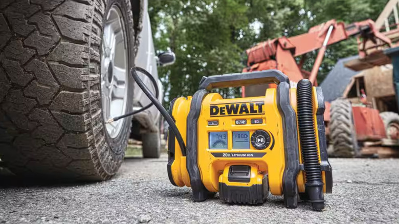 Inflator being used on a truck tire