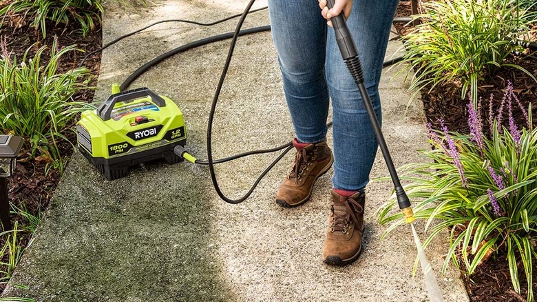 Ryobi pressure washer spraying sidewalk