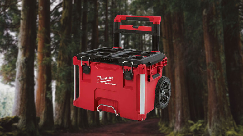 Milwaukee Packout rolling tool box with trees in the background