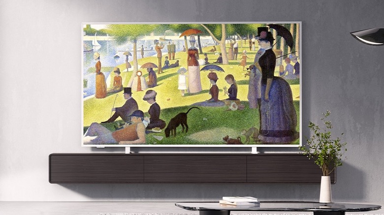 TCL NXTFRAME in a living room showing the painting A Sunday Afternoon on the Island of La Grande Jatte