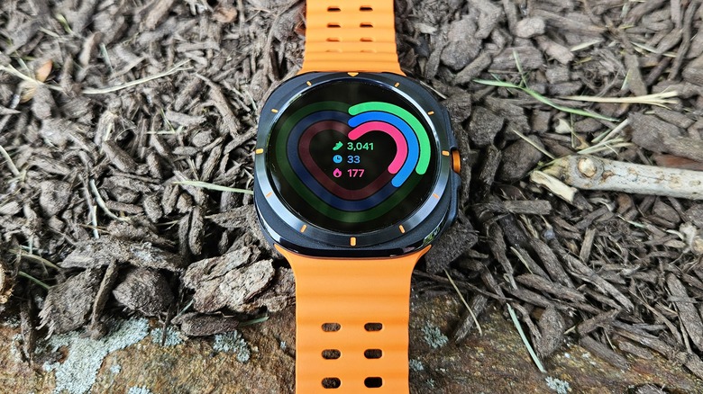 Samsung Galaxy Watch Ultra showing the activity rings on mulch