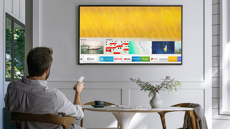 Person using Samsung's "The Frame" TV.