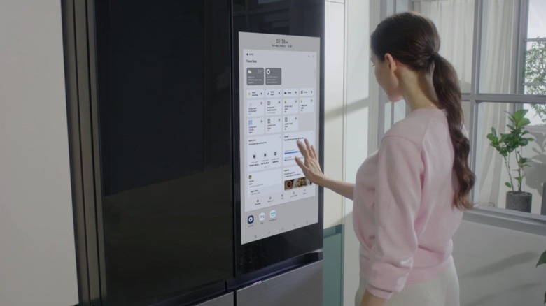 Person using the new Samsung Bespoke Family Hub Plus Refrigerator