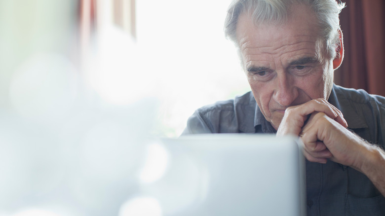 man looking at laptop