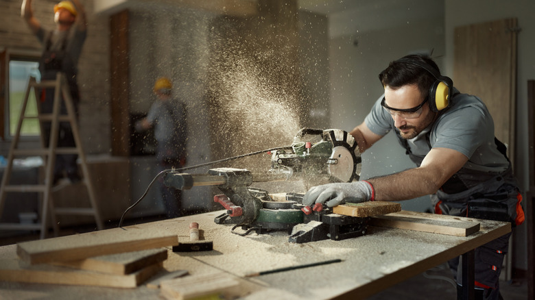 Man uses table saw