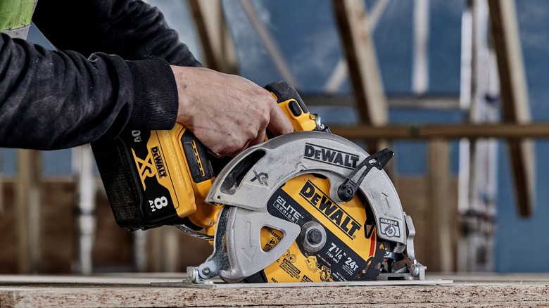 DeWalt saw cutting particle board