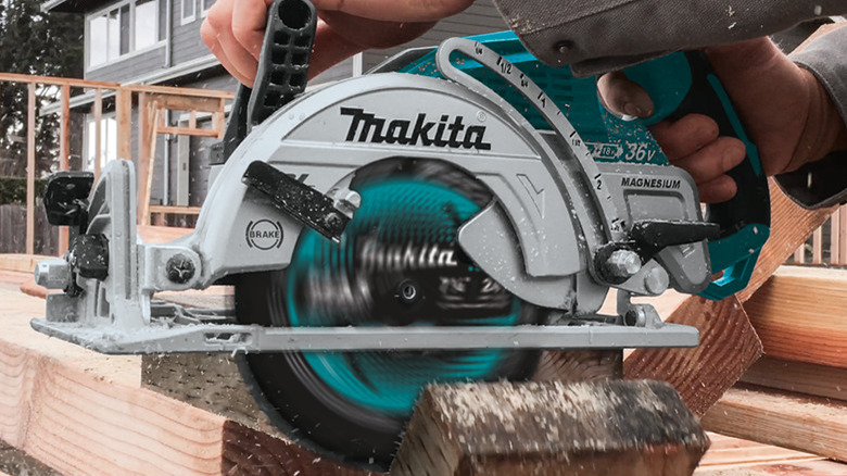 Makita saw cutting lumber