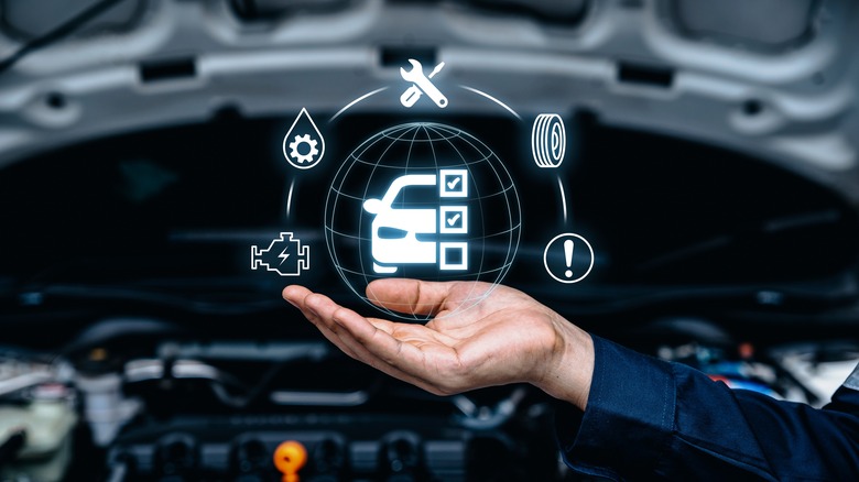 mechanic inspecting car