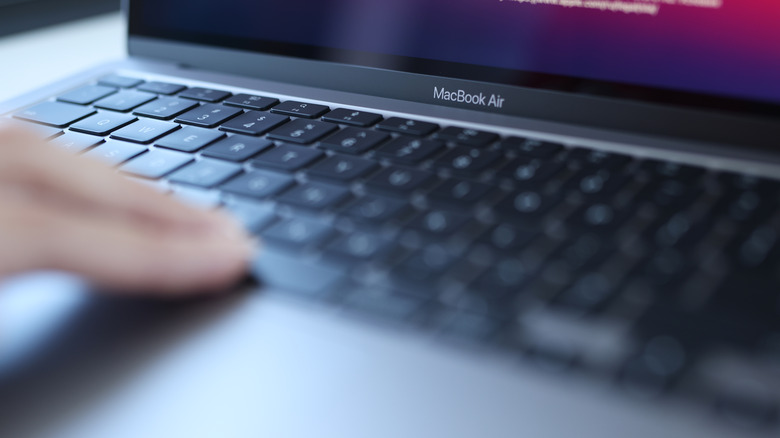 Woman uses an Apple Macbook Air.