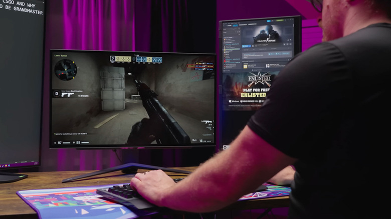 Man playing Counter Strike with multiple displays. 