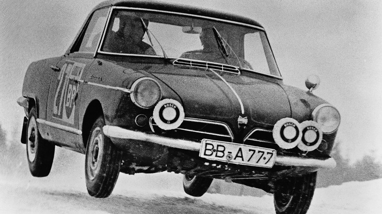 NSU Spider in snow rally race, jumping, front view