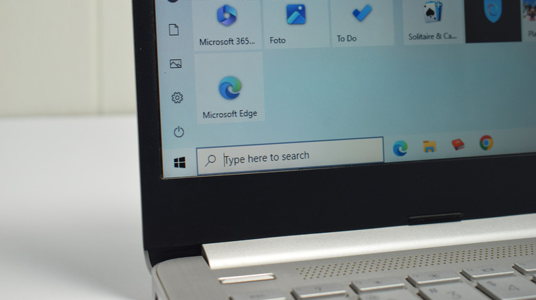 silver laptop showing Windows 10 start menu