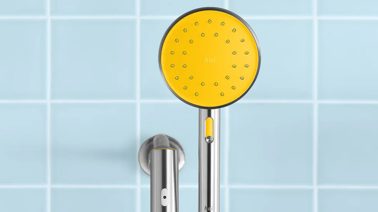 The smart showerhead from Hai on a blue background.