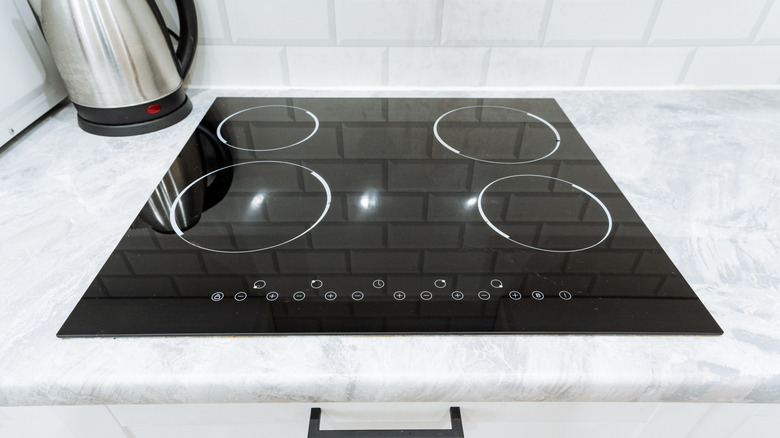 An induction cooktop on a white counter.