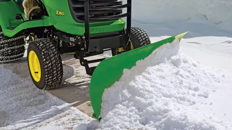 John Deere mower with snow blade