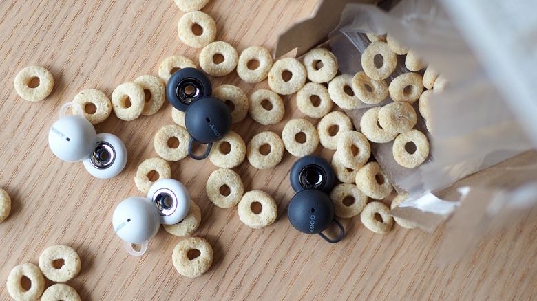 Gray and white LinkBuds in cereal