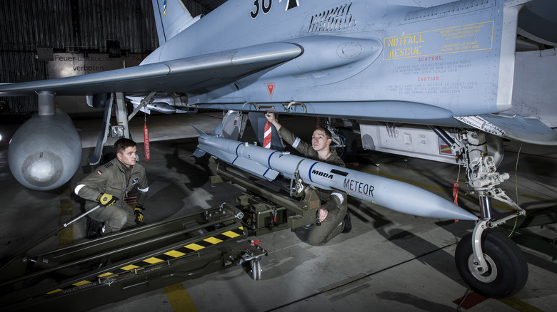 Meteor missile being attached to jet