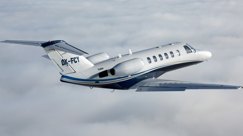 Cessna Citation flying through clouds