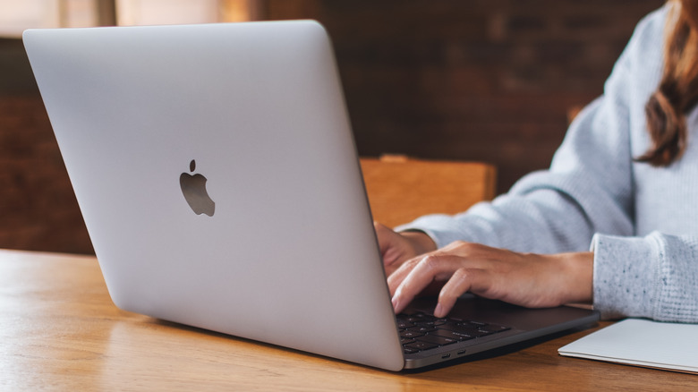 Typing on a MacBook keyboard