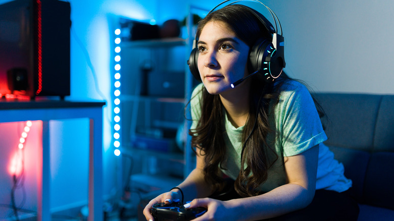 Girl gaming with headphones
