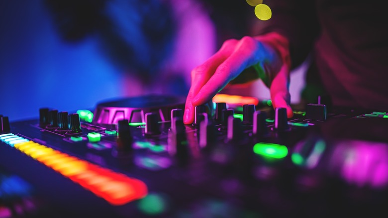 Club DJ using mixing board